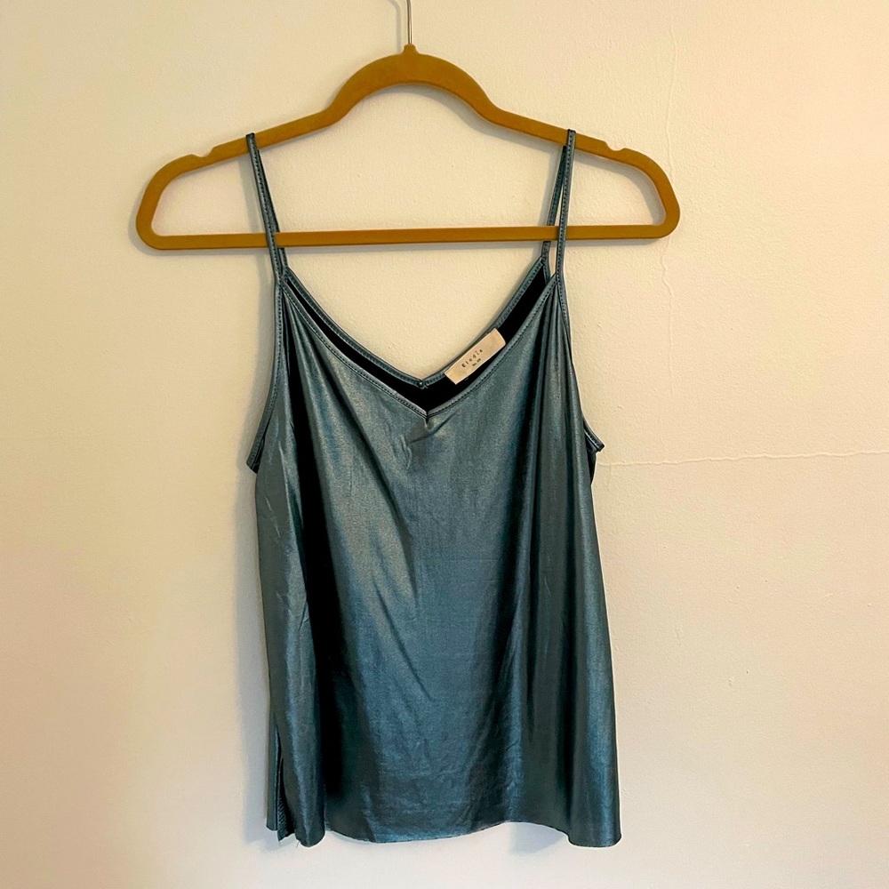 Metallic blue top! Super silky feeling, only worn once. No trades